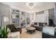 Inviting living room with built-in bookshelves, creating a cozy and organized space for relaxation at 1432 Red Mica Way, Monument, CO 80132