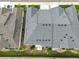 Aerial view of townhomes with gray roofs, showcasing the neat and organized community layout at 6712 Sea Oats Dr, Parker, CO 80138