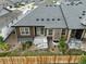 Backyard view with patios, rock landscaping, fencing, and green grass at 6712 Sea Oats Dr, Parker, CO 80138