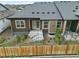 Backyard view with patio, rock landscaping, and a wooden fence for added privacy at 6712 Sea Oats Dr, Parker, CO 80138