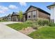 Exterior view of the house with a well-manicured lawn and beautiful landscaping at 6712 Sea Oats Dr, Parker, CO 80138