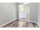 Hallway with wood-look floors and an archway leading to the main living area at 6712 Sea Oats Dr, Parker, CO 80138