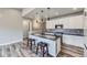 Stylish kitchen island with granite countertop and stools, seamlessly connecting to other living spaces at 6712 Sea Oats Dr, Parker, CO 80138