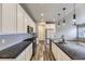 Modern kitchen featuring stainless steel appliances, granite counters, and ample cabinet space at 6712 Sea Oats Dr, Parker, CO 80138