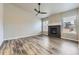Bright living room showcasing a modern fireplace and large windows at 6712 Sea Oats Dr, Parker, CO 80138