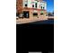 Exterior view of a local business with a brick facade and sidewalk with people walking by at 6712 Sea Oats Dr, Parker, CO 80138
