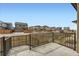 A cozy patio with view of neighborhood and railing, perfect for outdoor relaxing and entertainment at 6712 Sea Oats Dr, Parker, CO 80138