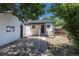 The backyard features a patio area, white siding, and access to the detached garage at 1900 Kingston St, Aurora, CO 80010