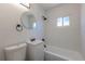 Modern bathroom with new sink, toilet, and tub/shower at 1900 Kingston St, Aurora, CO 80010