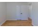 Clean bedroom showcasing wood floors and a pair of white doors at 1900 Kingston St, Aurora, CO 80010