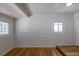 Bedroom with a coffered ceiling, hardwood floors and a window at 1900 Kingston St, Aurora, CO 80010
