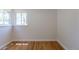 Bright bedroom featuring hardwood floors and a window letting in natural light at 1900 Kingston St, Aurora, CO 80010