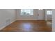 Cozy living room featuring hardwood floors and large window, creating a warm and inviting space at 1900 Kingston St, Aurora, CO 80010