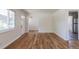 Open-concept living room with gleaming hardwood floors, offering a versatile and welcoming area at 1900 Kingston St, Aurora, CO 80010