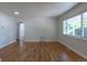 Bright and airy living room with hardwood floors and a large window providing ample natural light at 1900 Kingston St, Aurora, CO 80010