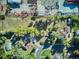 Aerial view showcases the property and outlines its boundaries in yellow at 7735 Westview Dr, Lakewood, CO 80214