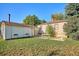 A backyard featuring a small outdoor patio and plenty of grassy area to enjoy time outside at 7735 Westview Dr, Lakewood, CO 80214