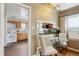 Cozy dining area connects the living room and kitchen with a serving hatch at 7735 Westview Dr, Lakewood, CO 80214