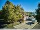 Charming single-Gathering home features a spacious driveway and mature trees at 7735 Westview Dr, Lakewood, CO 80214