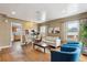 Inviting living room boasts hardwood floors and lots of natural light at 7735 Westview Dr, Lakewood, CO 80214