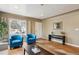 Cozy living room with hardwood floors, natural light and comfortable seating at 7735 Westview Dr, Lakewood, CO 80214