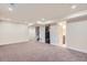 Versatile basement space with carpet, recessed lights, and an open doorway to a bathroom and stairs at 10472 Lincoln Ct, Northglenn, CO 80233