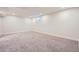 Expansive basement area with neutral carpet, recessed lighting, and white trim, perfect for customization and various uses at 10472 Lincoln Ct, Northglenn, CO 80233