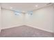 Carpeted basement area with windows, recessed lighting, and white trim; offering potential for a cozy and functional living space at 10472 Lincoln Ct, Northglenn, CO 80233