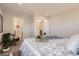 Cozy bedroom featuring natural light, calming decor, and ensuite bathroom at 10472 Lincoln Ct, Northglenn, CO 80233
