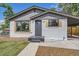 Charming single-story home featuring a landscaped front yard, covered porch, and updated exterior paint at 10472 Lincoln Ct, Northglenn, CO 80233
