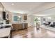 Bright kitchen features stainless steel appliances, modern cabinets, recessed lighting, and hardwood floors at 10472 Lincoln Ct, Northglenn, CO 80233