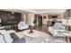 Open concept living and dining area featuring hardwood floors, modern decor, and stainless steel appliances at 10472 Lincoln Ct, Northglenn, CO 80233