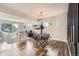 Open concept living space with hardwood floors, dining area, and ample natural light at 10472 Lincoln Ct, Northglenn, CO 80233