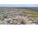 An aerial view of a residential community near a lake, showcasing the neighborhood layout and scenic surroundings at 6614 S Vandriver Way, Aurora, CO 80016
