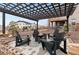 Backyard patio with fire pit surrounded by chairs for relaxing outdoor living and entertaining at 6614 S Vandriver Way, Aurora, CO 80016