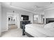 Open bedroom floorplan featuring tray ceilings, access to a bathroom, and fireplace at 6614 S Vandriver Way, Aurora, CO 80016