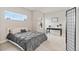 Bedroom with neutral walls, carpet, a window, a black bedspread with decorative pillows and a black writing desk at 6614 S Vandriver Way, Aurora, CO 80016