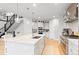 Spacious kitchen with an island, stainless appliances and quartz countertops at 6614 S Vandriver Way, Aurora, CO 80016