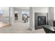 Main bedroom featuring a fireplace, sitting chair, carpet, and doorway to the walk in closet at 6614 S Vandriver Way, Aurora, CO 80016