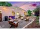 Backyard area with a cozy fire pit and outdoor seating at 2530 S Knox Ct, Denver, CO 80219