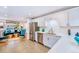 Modern kitchen with stainless steel appliances and an open view to the living room at 2530 S Knox Ct, Denver, CO 80219