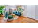 Bright living room featuring hardwood floors, modern decor, and ample natural light at 2530 S Knox Ct, Denver, CO 80219