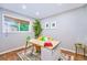 Bright home office with a large window and cozy decor at 2530 S Knox Ct, Denver, CO 80219