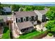 This home has a well-maintained backyard featuring a covered patio, stone pathway, lush lawn, and privacy fence at 2011 Sundrop Trl, Highlands Ranch, CO 80126