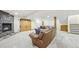 Finished basement with stone fireplace, leather furniture, and wooden accents at 2011 Sundrop Trl, Highlands Ranch, CO 80126