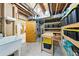 Unfinished basement includes storage shelves and exposed utilities at 2011 Sundrop Trl, Highlands Ranch, CO 80126
