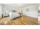 Relaxing bedroom featuring wood floors and neutral decor at 2011 Sundrop Trl, Highlands Ranch, CO 80126