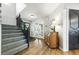 Inviting foyer with wood floors, staircase, and decorative accents at 2011 Sundrop Trl, Highlands Ranch, CO 80126