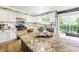 Kitchen with granite countertops, white cabinets, stainless steel sink, and decorative backsplash at 2011 Sundrop Trl, Highlands Ranch, CO 80126