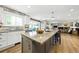 Kitchen featuring white cabinets, granite countertops, stainless steel appliances, and natural light at 2011 Sundrop Trl, Highlands Ranch, CO 80126